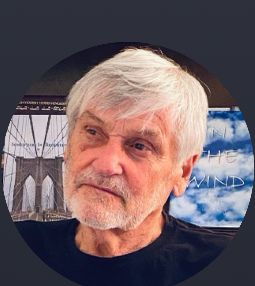 Author JK Savoy in front of his book covers